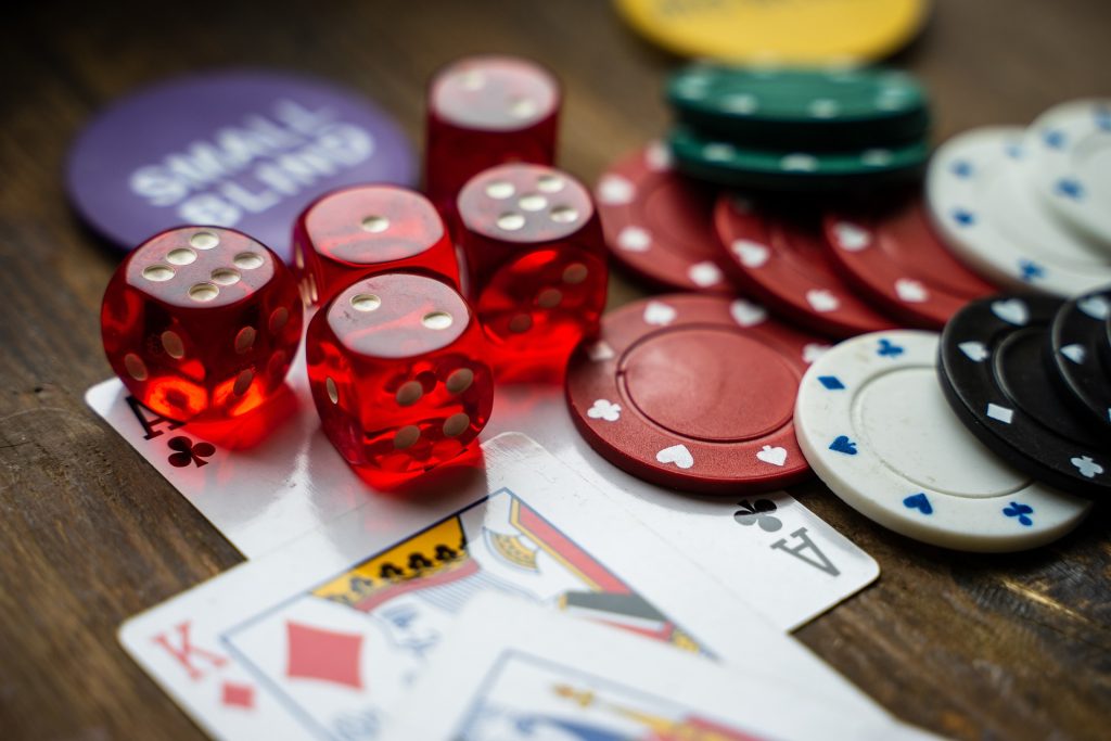 cards dice and poker chips on a table