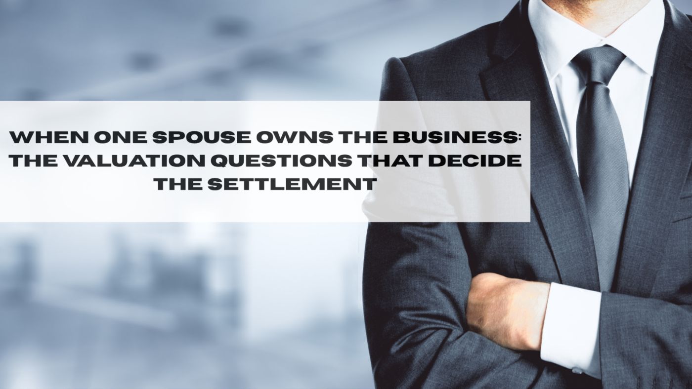 Business owner reviewing company financial statements with an attorney during a New York divorce
